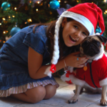 girl and dog on Christmas