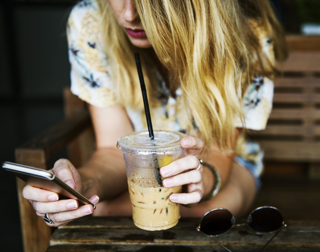 lady drinking coffee on phone